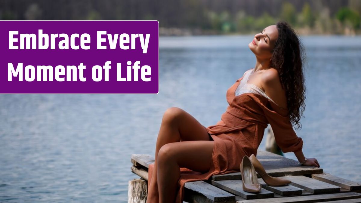 A girl with long wavy curly hair in a long guipure dress barefoot in the summer in a forest on a lake at sunset standing on a pantone on a wooden pier bridge. Summer sunny day.