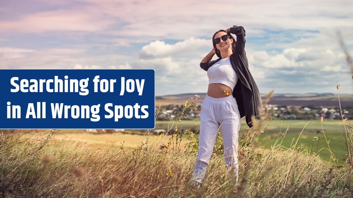 Happy young pretty woman enjoying the landscape near green field in summer time.