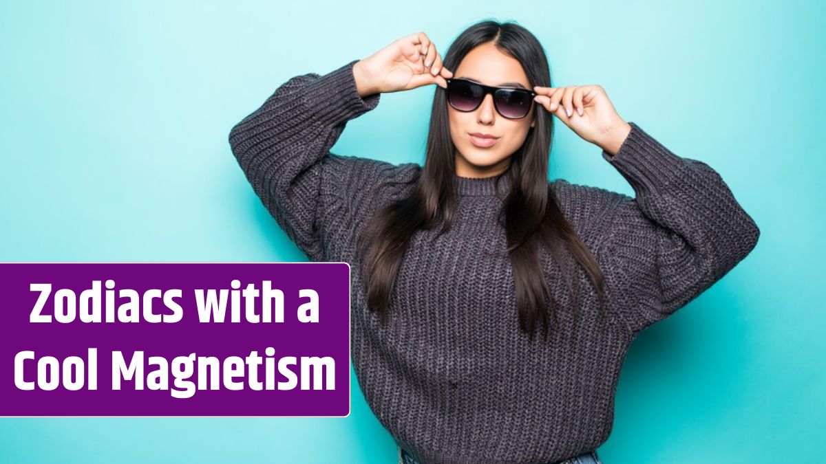 Portrait of a young woman in sweater in sunglasses looking away at copy space isolated on blue.