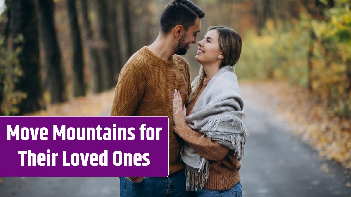 Couple together in park covered in blanket.