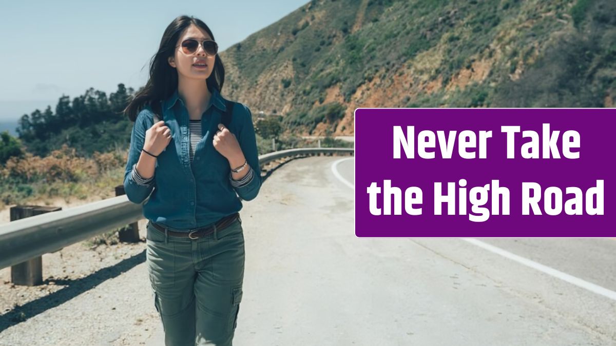 Vintage photo young local woman in trendy sunglasses standing in side of highway 1 and looking away enjoying fresh air.