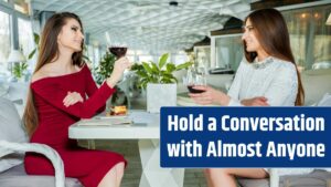 Two female friends drink red wine in a restaurant.